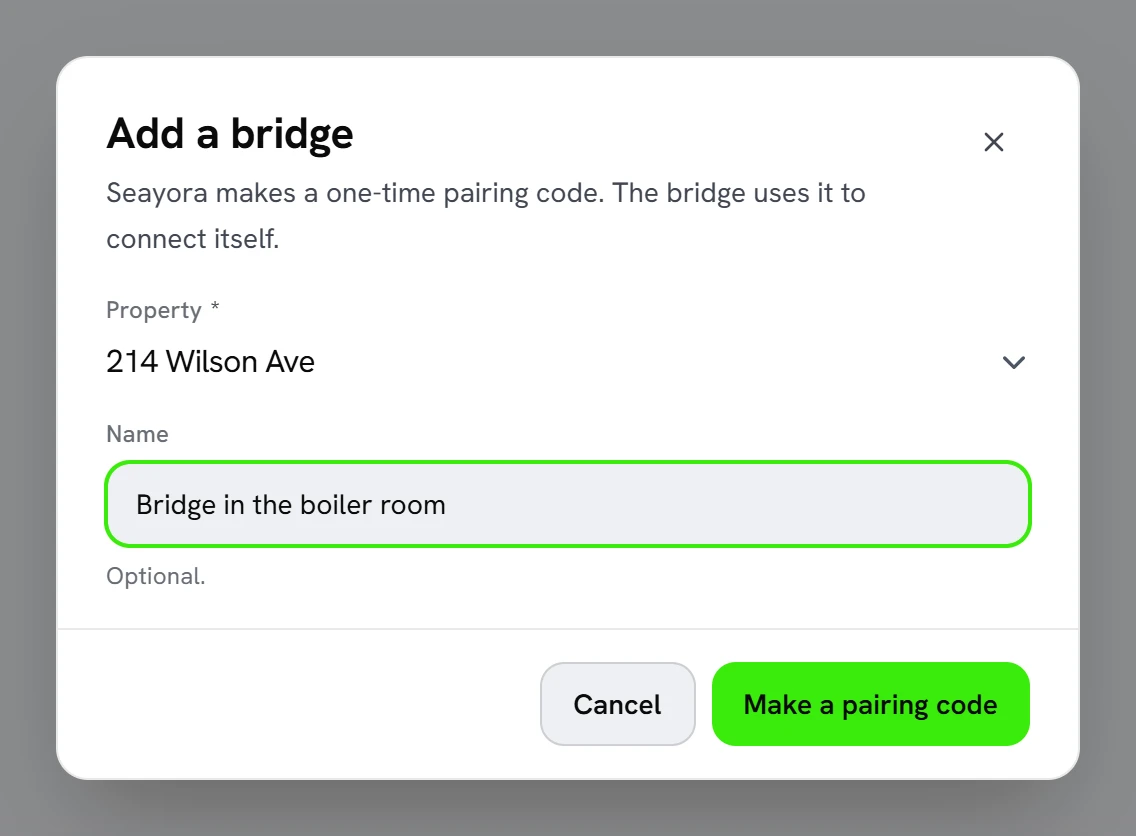 The “Add a bridge” dialog in Seayora, with the property 214 Wilson Ave chosen, the name “Bridge in the boiler room” typed in, and a “Make a pairing code” button.