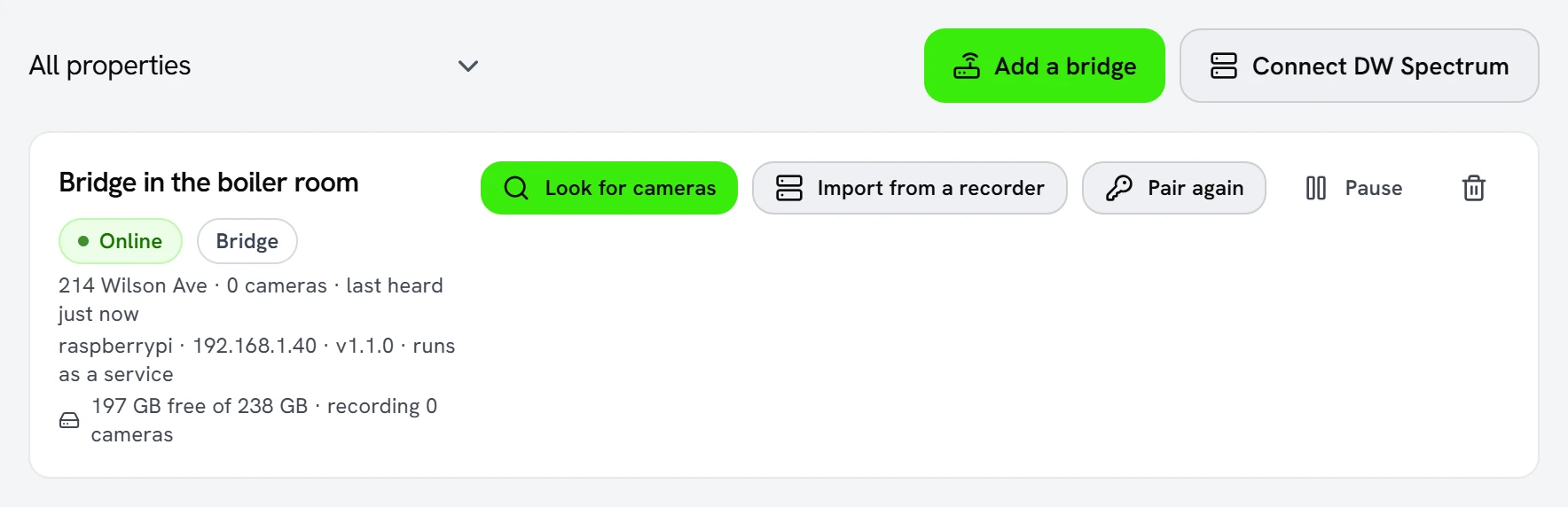 The Bridges tab in Seayora, showing “Bridge in the boiler room” at 214 Wilson Ave as online, with its computer name, network address, version and free disk space, and a “Look for cameras” button.
