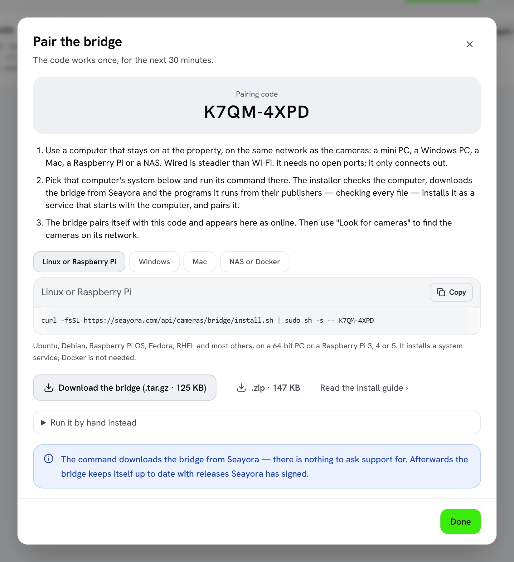 The “Pair the bridge” screen in Seayora: a pairing code, three numbered steps, a choice of Linux or Raspberry Pi, Windows, Mac, or NAS or Docker, the install command for the chosen system with a note on what it needs, and buttons to download the bridge as a .tar.gz or a .zip.