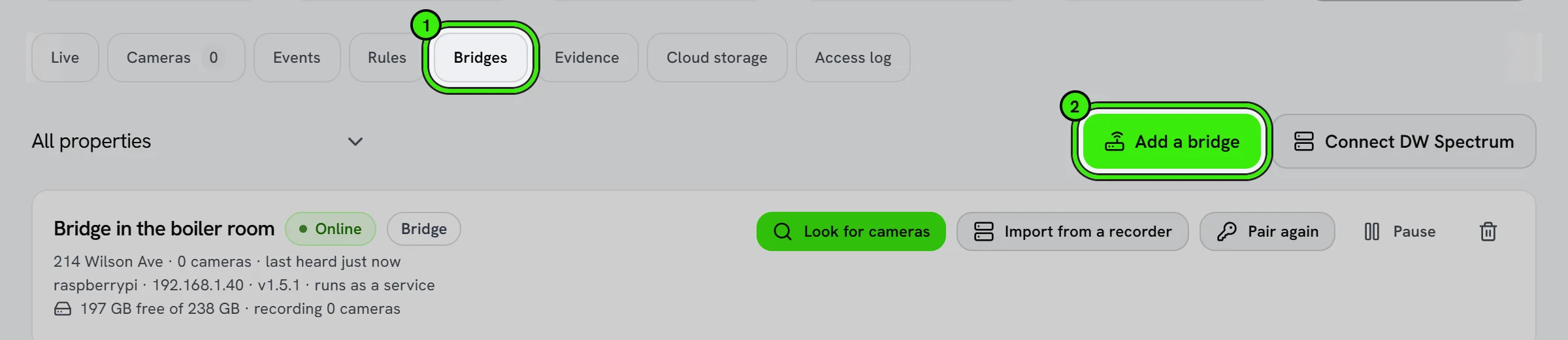 Security cameras, Bridges tab: one bridge, Bridge in the boiler room at 214 Wilson Ave, online, with Look for cameras, Import from a recorder and Pair again. The Bridges tab and Add a bridge are ringed.