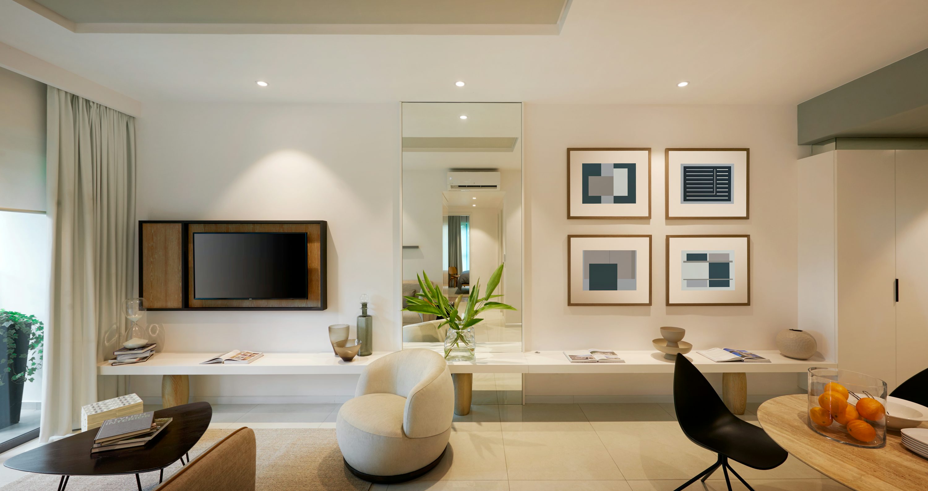 Modern living room interior with stylish decor and wall art.