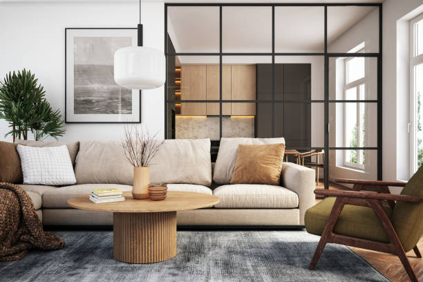 Modern living room featuring a beige sofa, wooden coffee table, and stylish decor elements with a view of an adjoining kitchen.