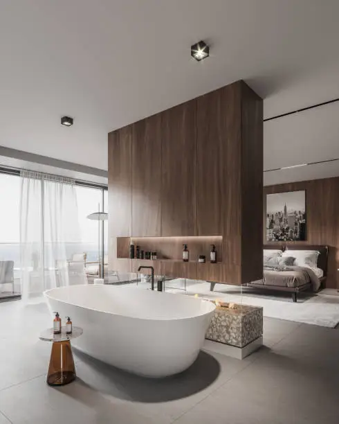 Modern bedroom featuring a freestanding bathtub, elegant wooden accents, and stunning city views.