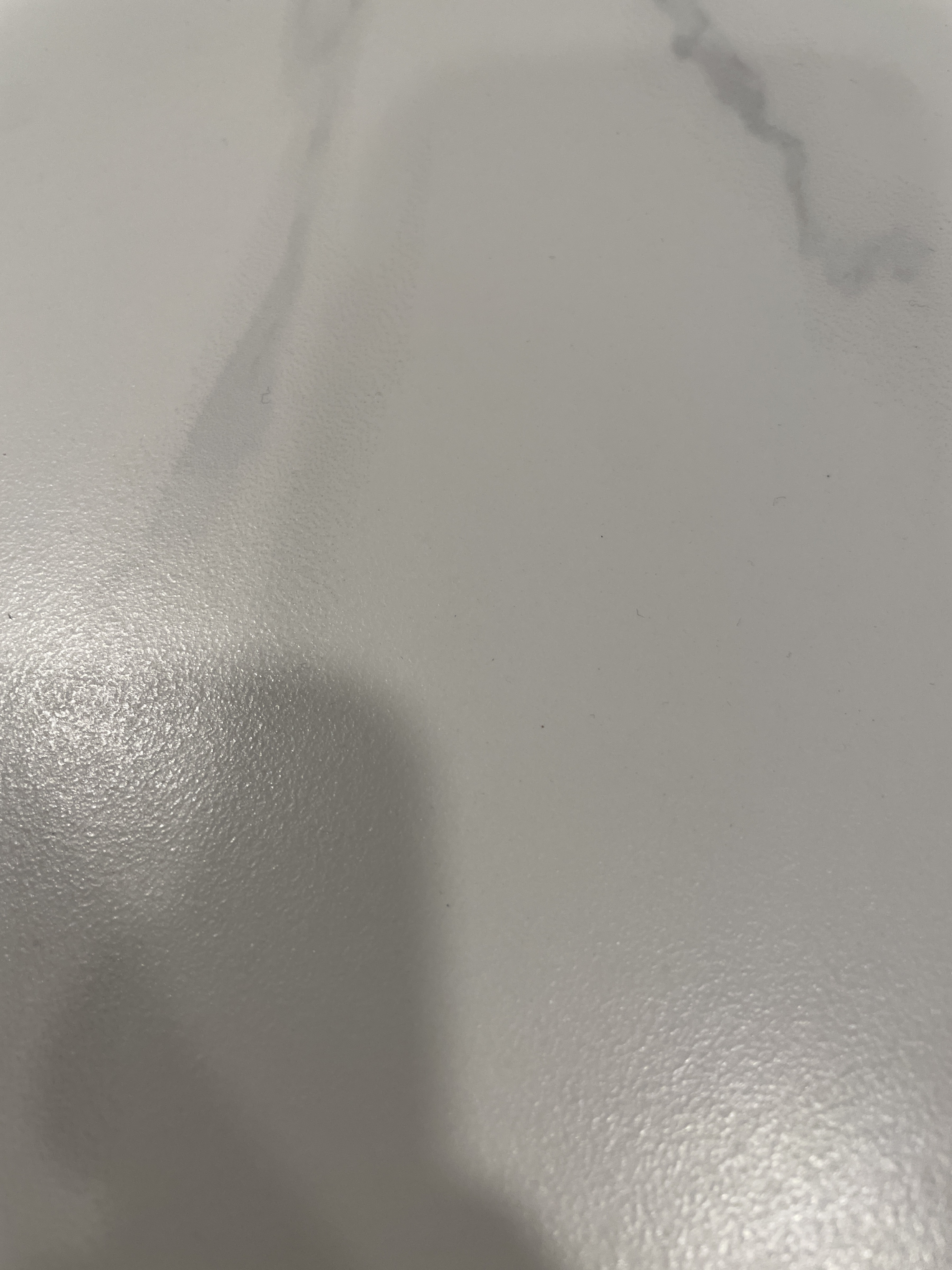 Close-up of a polished marble countertop surface.